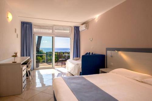 Katil atau katil-katil dalam bilik di Hotel Paradiso