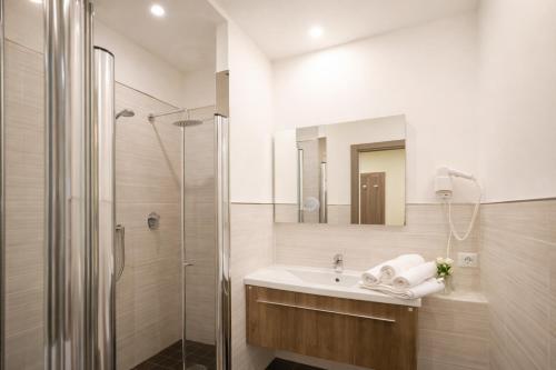 a bathroom with a sink and a shower at Residence Elisabetta in Cesenatico
