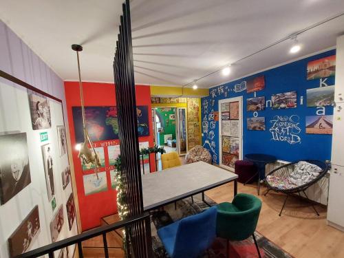 a dining room with a table and some chairs at Hostel Amazing Ionika CenterCity in Chişinău