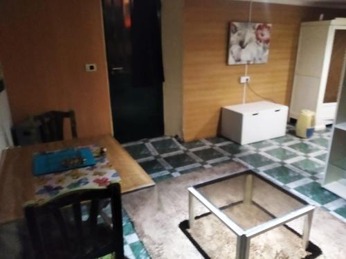 a living room with a table and a glass table sidx sidx sidx at A morada do peregrino in Poio