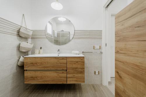 a bathroom with a sink and a mirror at Holiday burrone in Favignana