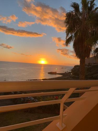 a sunset from the balcony of a condo at Formosa Beach Apartment Vista Mar a 2 Minutos da Praia in Funchal