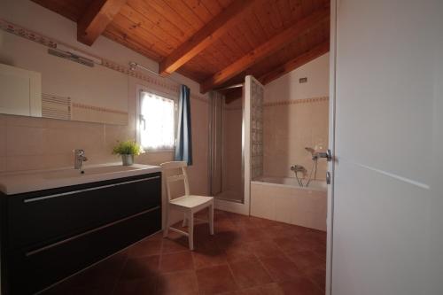 a bathroom with a sink and a tub at Casa Marcone in Deiva Marina