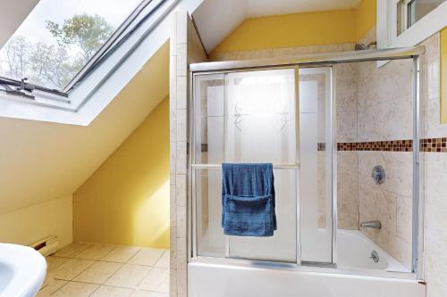 a bathroom with a shower and a sink at 3 Mi to Franklin Park Zoo! Bright Residential Stay in Boston