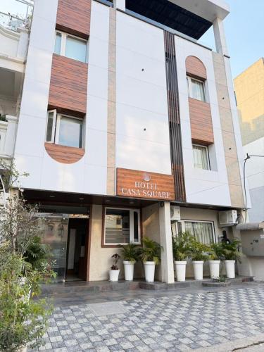 a building with a sign that reads hotel carolean boutique at Hotel Casa Square in Indore