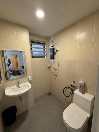 a bathroom with a toilet and a sink at InapByDaddy's Near KLIA SIC Sepang 4BR Fully Aircond in Sepang