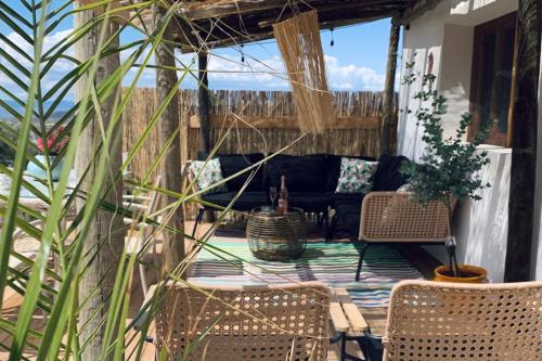 a patio with chairs and a couch on a porch at Ruime cortijo met zwembad in Andalusië ideaal voor families & groepen 3 appartementen in Huércal-Overa