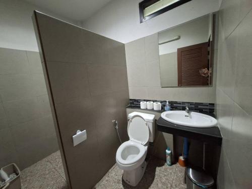 a bathroom with a toilet and a sink at Little Blue House- AoNang in Ao Nang 