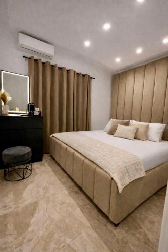 a bedroom with a large bed and a table at Casa Amor in Neum