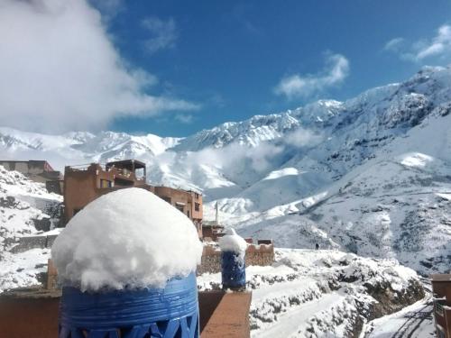 a blue barrel covered in snow on top of a mountain at riad atlas imnane in Imlil