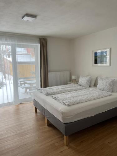 a large bed in a room with a window at Litovelské apartmány in Litovel