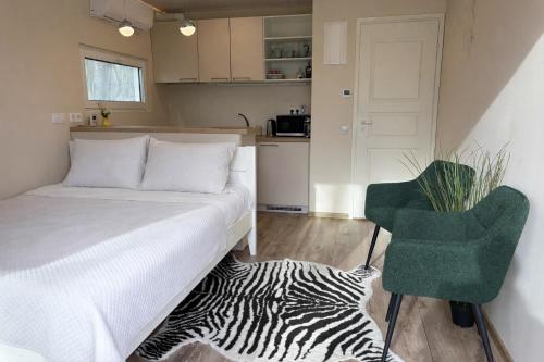 a small bedroom with a bed and a zebra rug at Pauna Puhkemajad in Tori