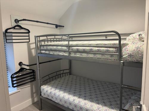 a bedroom with two bunk beds in a room at OMalleys Town House in Buncrana