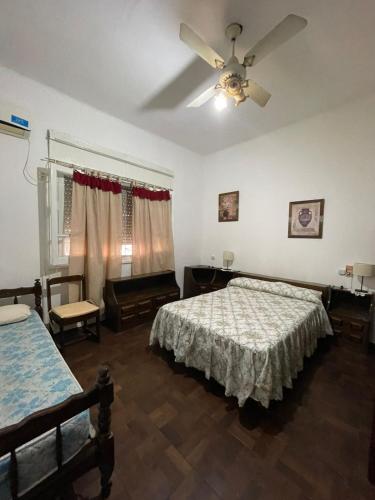 Llit o llits en una habitació de Urquiza 575