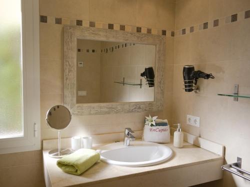 a bathroom with a sink and a mirror at Apartment En Capillo in Manacor