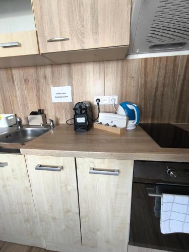 a kitchen with a sink and a counter top at Kralovak in Králŭv Dvŭr