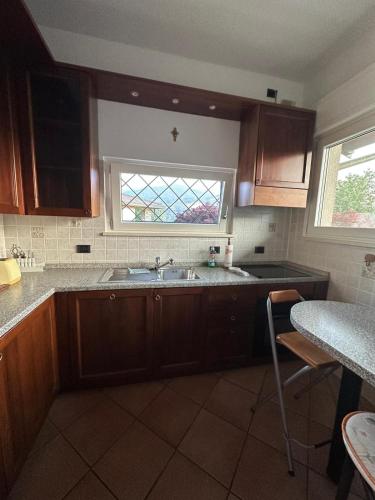 a kitchen with a sink and a window at Casa Gioia in Besano
