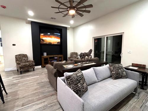 a living room with a couch and a table at Desert retreat 3BR close to River and Casinos in Bullhead City