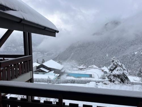 a view of a snow covered mountain from a balcony at Alpstay - Résidences des Bains d'Ovronnaz - Studio SUD S204 in Ovronnaz