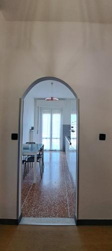 a room with a table and a dining room at Via Roma 48 in Arquata Scrivia