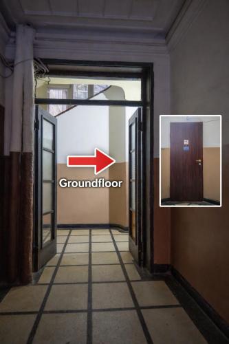 an open door with an arrow pointing to a ground floor at Martin's Treasure TOP CENTER in Sofia