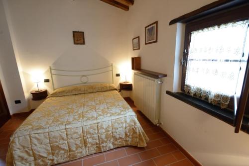 Ένα ή περισσότερα κρεβάτια σε δωμάτιο στο Agriturismo La Casuccia