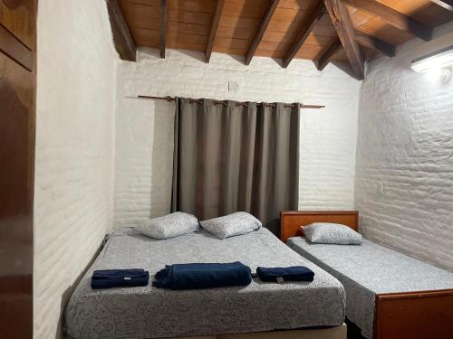 Llit o llits en una habitació de Guaviyu Emprendimiento