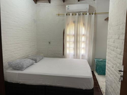 Llit o llits en una habitació de Guaviyu Emprendimiento