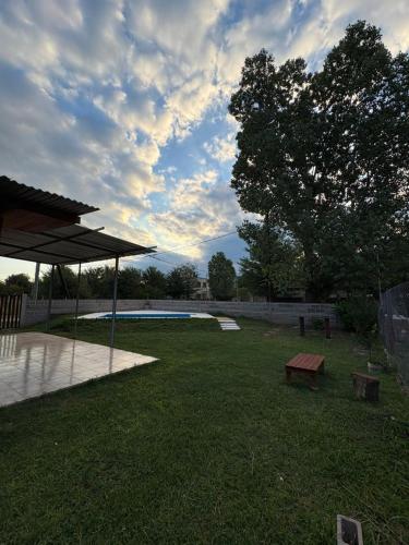 a park with a picnic table and a bench at Las tres lunas 2 in Villa Anizacate