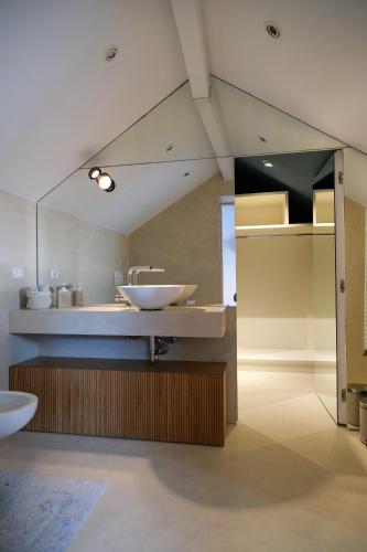 a bathroom with a sink and a mirror at La Perla di Boccadasse in Genoa