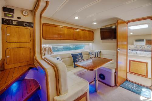 a interior of an rv with a table and a bed at Villa Degli Ulivi in Furore