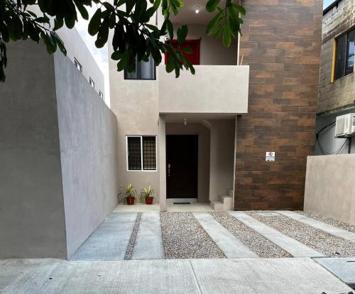 a building with a hallway and a door to a building at Departamento Paty in Tampico