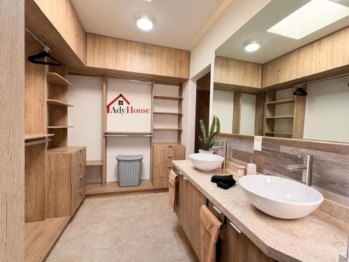 a bathroom with two sinks on a counter at AdyHouse Ziré in Buena Vista