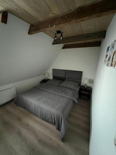 a bedroom with a bed and two night stands at Auental in Husum