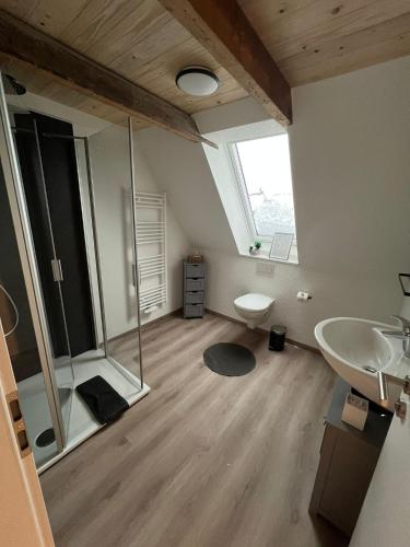 a bathroom with a shower and a sink at Auental in Husum
