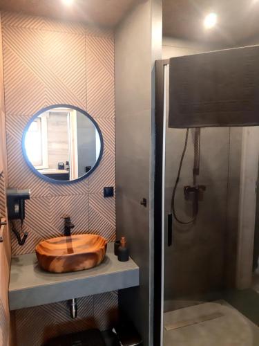 a bathroom with a wooden sink and a mirror at Koziniec ski & chill in Czarna Góra