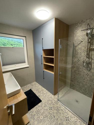 a bathroom with a shower and a sink at Chata-Elko Habovka in Habovka