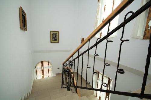 a staircase in a house with at Pensiunea Eden in Băile Olăneşti
