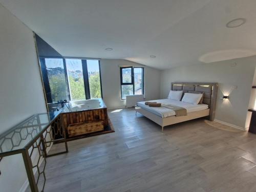 a large living room with a bed and a sink at Suiton6 apart otel in İhsaniye
