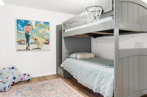 a kids bedroom with a bunk bed and a basketball hoop at House - Minutes from Siesta Key! in Sarasota