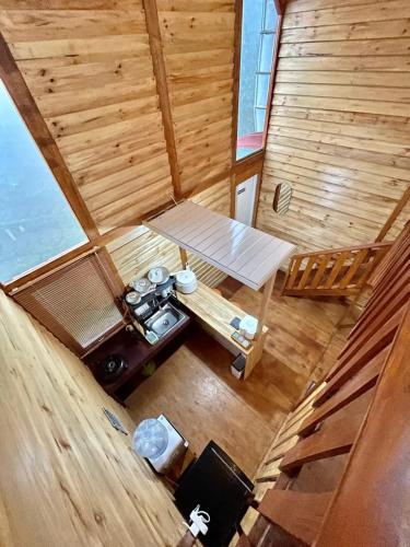 an overhead view of a room in a wooden cabin at Miarzafa Cabin House DIENG in Kejajar
