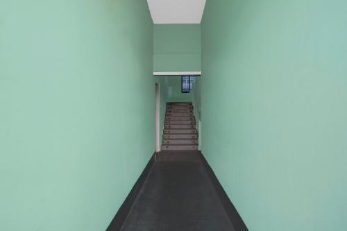 a hallway with a staircase in a building at SPOT ON S.D.S GUEST HOUSE in Guwahati