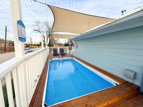 a swimming pool on the side of a house at Sweet Houston, 14 People, 4 Bethroom, 2 Full Restrooms in Houston