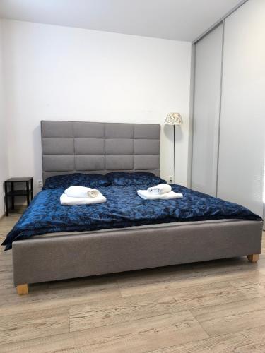a bedroom with a bed with two pillows on it at Severan New Appartement 2 in Martin