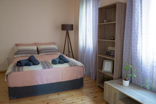 a bedroom with a bed with blue towels on it at Hidden gem agora flat Checkpoint-Mytilene in Mytilene