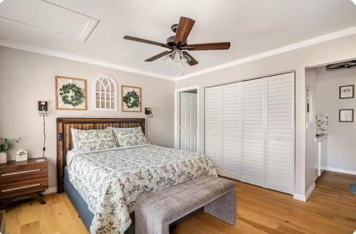a bedroom with a bed and a ceiling fan at Studio retreat by the river in Tampa