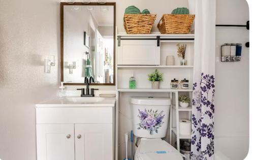 a bathroom with a toilet and a sink and a mirror at Studio retreat by the river in Tampa