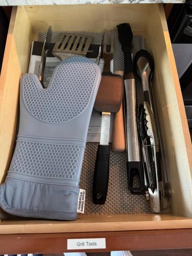 a box filled with kitchen utensils and tools at Minutes to Manasota Beach 2 King Beds Fenced yard Pets Welcome in Englewood