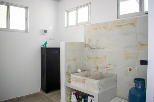 a bathroom with a sink in a room at Villa Majo in Nocaima