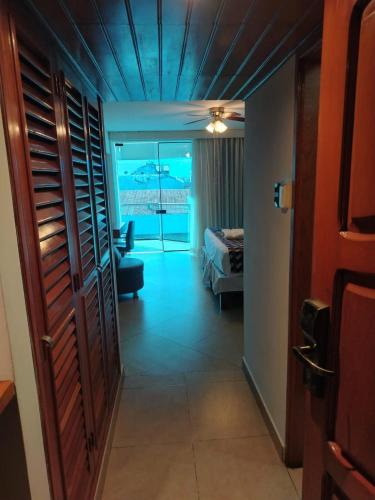a room with a bed and a room with a view at Samiria Jungle Hotel in Iquitos